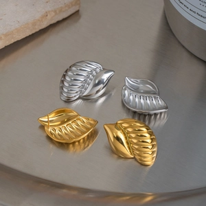 Creative leaf-shaped stainless steel stud earrings in silver and gold polished finish