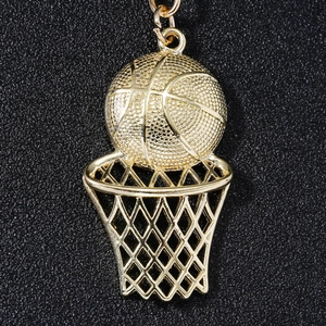 Polished golden stainless steel basketball hoop keychain with intricate net details