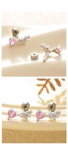Detailed macro view of pink heart zircon stud earrings with silver butterfly accent