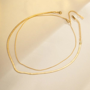 Golden double-layer herringbone snake chain necklace with adjustable extension