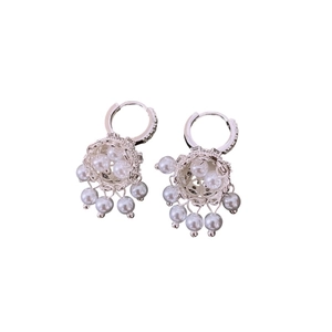 Silver cage tassel earrings with white pearls and zircon accents on white background