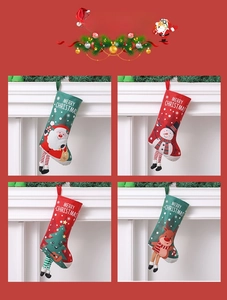 Detail of four Christmas stockings featuring Santa, snowman, and reindeer with striped legs