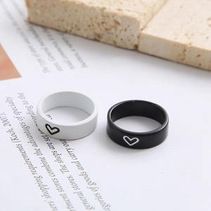 Minimalist black and white matte rings with heart symbols for couples and lovers