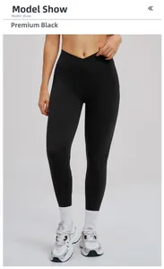 Détail du pantalon de yoga noir à taille haute avec une ceinture croisée en forme de V