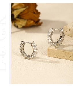Detail view of silver S925 sterling silver hoop earrings with sparkling moissanite stones