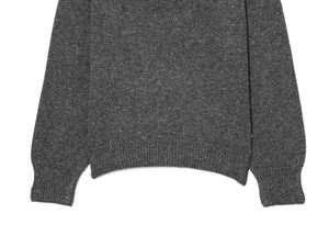 Detail view of heather grey knit fabric showing ribbed cuffs and hem texture