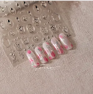 Detailed relief tulip nail stickers with metallic silver texture and floral patterns