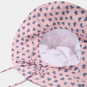Pink sun hat for kids with blue heart pattern and breathable white mesh lining