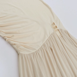 Detail of sheer mesh dress with elegant beads and side waist cutout design