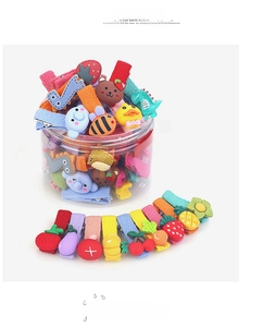 Close-up of colorful cartoon hair clips set for girls in a clear storage container