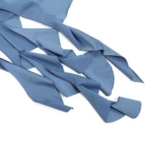 Detail of blue soft fabric texture and ruffled edges for beach holiday dresses