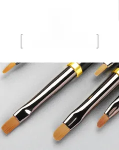 Macro detail of high-quality PBT nylon nail art brush bristles with gold metal ferrules