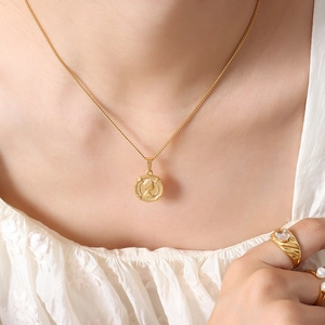 French palace style gold coin necklace with queen relief pendant on model