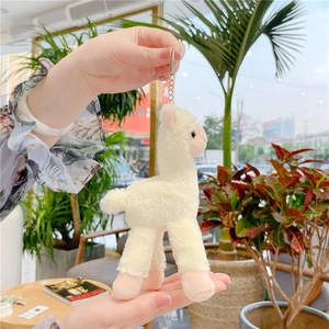 Cute cream-colored alpaca plush keychain with soft fabric and metal ring for bags