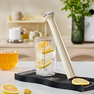 Manual beverage muddler set with a 500ml plastic measuring cup and ice crusher tool