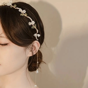 Elegant lily of the valley headband with pearls, green leaves and hanging tassels
