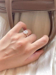 Close-up of S925 sterling silver ring with a hexagon crystal on a woman's finger