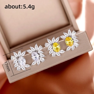 Sparkling gold flower-shaped stud earring set with yellow and clear zircon stones