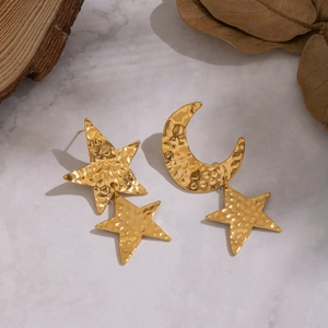 Close-up of hammered 18K gold plated celestial moon and star stud earrings for women