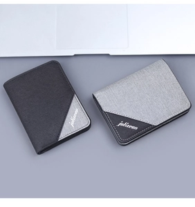 Detailed view of minimalist bifold canvas wallets in black and grey with logo