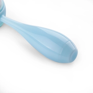 Close-up of light blue ergonomic handle with high-gloss finish for beauty massage device