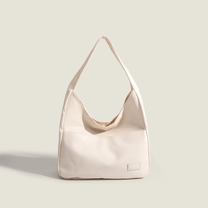 Minimalist cream white hobo shoulder bag in matte PU leather for daily commuting style
