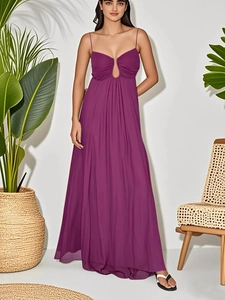 Detail of purple maxi dress showing thin straps and delicate cut-out design on the neckline