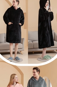 Detail of oversized hooded blanket with large pocket in thick warm fleece material