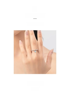 Detail view of s925 sterling silver beaded ring with a blue heart enamel pendant