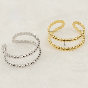 Detail showing 18K gold plated double-layer beaded adjustable stainless steel ring for women