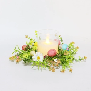 Easter floral candle ring with LED light, colorful eggs and daisy blossoms for spring decor