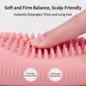 Pink silicone scalp massager brush with 108 flexible bristles for shampooing and massage