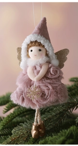 Detail of plush Christmas angel hanging with pink rose dress and golden wings on pine tree