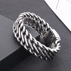Macro shot of 316L stainless steel engraving on silver chunky cuban chain bracelet