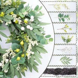 Detailed view of artificial eucalyptus wreath components with green leaves and white berries