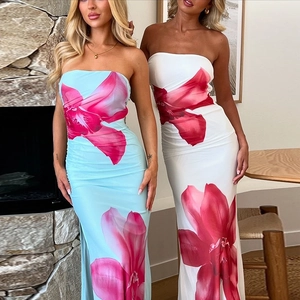 Detailed view of floral tube maxi dresses featuring side slits and slim fit silhouette