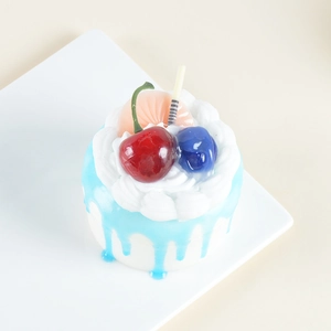 Realistic artificial blue and white cream cake on white plate for display and decoration