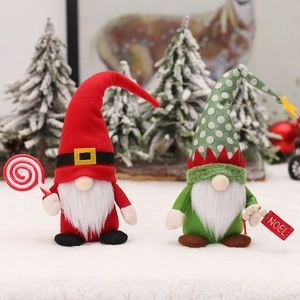 Christmas gnome dolls in red and green with lollipops for festive home window decoration