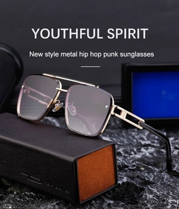 Detail of square rimless punk sunglasses with gradient lenses on a leather case