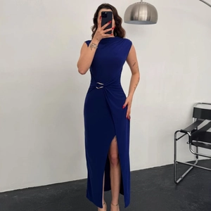 Detail of royal blue maxi dress featuring gold waist ring and side slit design