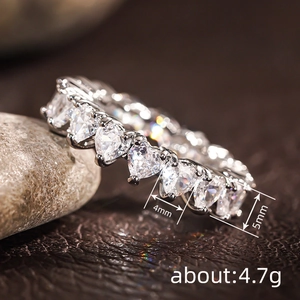 Detail of 4.7g eternity ring featuring heart-cut 4mm*5mm white stones in claw setting