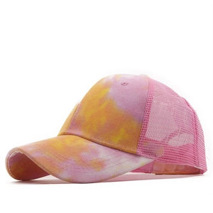 Colorful tie-dye trucker hat with pink mesh back and curved brim for sun protection