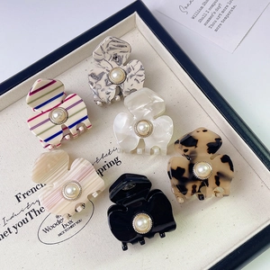 Set of six French vintage acetate flower hair claws with elegant pearl embellishments
