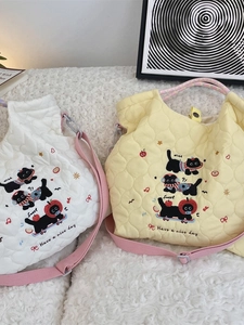 Quilted heart tote bag with cute black cat embroidery and pink woven shoulder straps