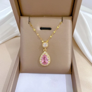 Elegant gold-plated teardrop necklace with a large pink gemstone and micro-pave zirconia