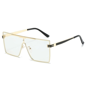 Modern oversized square metal sunglasses with gold and black frames and clear lenses