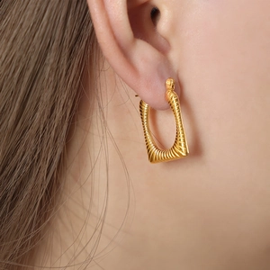 Elegant gold plated titanium U-shape earrings with spiral texture for women