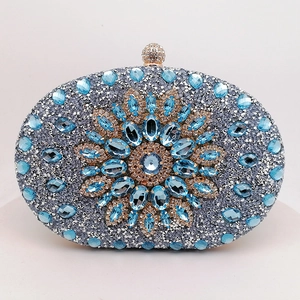Luxury oval clutch bag with blue rhinestones and floral crystal pattern for weddings