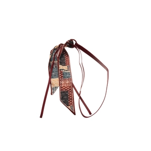 Retro wine red printed silk scarf belt with ethnic patterns on a white background