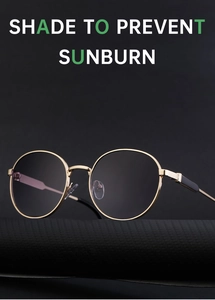 Detailed close-up of retro round gold metal frame sunglasses with black polarized lenses